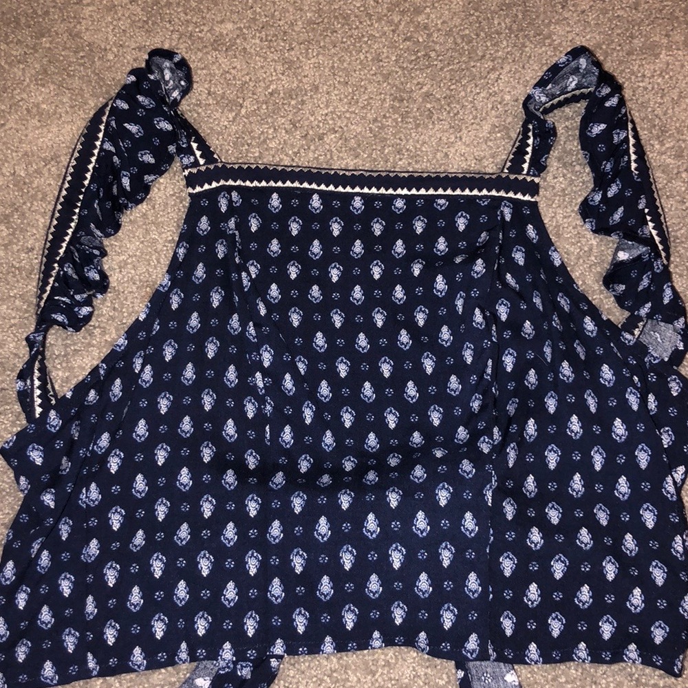 cropped backless shirt.